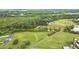 An aerial view features property lines, pond, and bordering trees at 4874 Thom Rd, Mebane, NC 27302