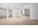 Neutral basement with tiled floor and stairs to the main level at 4874 Thom Rd, Mebane, NC 27302