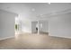 View of a bright basement with neutral walls and door to the exterior at 4874 Thom Rd, Mebane, NC 27302