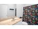 Bathroom featuring a shower curtain, single vanity, and mirror at 4874 Thom Rd, Mebane, NC 27302