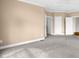 Large bedroom featuring neutral walls, base trim, and carpeting at 4874 Thom Rd, Mebane, NC 27302