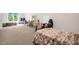 View of the large bedroom with space for study and multiple beds at 4874 Thom Rd, Mebane, NC 27302