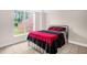 Bedroom with large window providing natural light and a iron bed frame at 4874 Thom Rd, Mebane, NC 27302