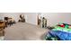 Large bedroom shows multiple beds and study space at 4874 Thom Rd, Mebane, NC 27302