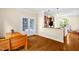 View of kitchen and dining area featuring wooden table and French doors to outside at 4874 Thom Rd, Mebane, NC 27302