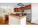 Well-equipped kitchen featuring granite countertops, stainless steel appliances, and custom cabinets at 4874 Thom Rd, Mebane, NC 27302