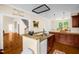 Open kitchen layout with granite countertops and hardwood floors at 4874 Thom Rd, Mebane, NC 27302