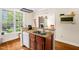 Kitchen bar with stainless steel sink and large window overlooking the property at 4874 Thom Rd, Mebane, NC 27302