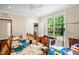 Bright room with ample natural light from a large window and ceiling fan above at 4874 Thom Rd, Mebane, NC 27302