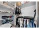 Spacious walk-in closet with custom shelving and hanging rods offers ample storage at 5020 Mimosa Dr, Durham, NC 27713