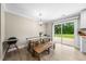 Eat-in kitchen and dining area features a sliding glass door with backyard views at 5020 Mimosa Dr, Durham, NC 27713