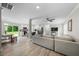 Spacious open-concept living room featuring modern flooring, light paint, and a view into the kitchen at 5020 Mimosa Dr, Durham, NC 27713