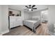 Comfortable main bedroom with wood-look floors, ceiling fan and ensuite bathroom at 5020 Mimosa Dr, Durham, NC 27713