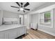Inviting main bedroom features a ceiling fan, bed and a window at 5020 Mimosa Dr, Durham, NC 27713