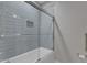 Modern bathroom featuring a tiled shower and glass door at 511 Hamilton Cottage Way, Raleigh, NC 27605