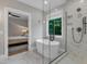 This modern bathroom features a shower, soaking tub, and an open doorway to the bedroom at 511 Hamilton Cottage Way, Raleigh, NC 27605