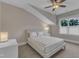 This bedroom features neutral tones, a ceiling fan, and a large window allowing plenty of natural light at 511 Hamilton Cottage Way, Raleigh, NC 27605