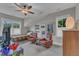 Bedroom with a ceiling fan, daybed, and windows offering natural light at 511 Hamilton Cottage Way, Raleigh, NC 27605