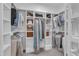 Walk-in closet equipped with custom shelving and storage, perfect for organizing clothes and accessories at 511 Hamilton Cottage Way, Raleigh, NC 27605