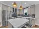 Bright kitchen showcasing a large center island, stainless steel appliances, and modern cabinetry at 511 Hamilton Cottage Way, Raleigh, NC 27605