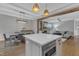 Open kitchen with a center island, connecting the dining and living areas for easy entertaining at 511 Hamilton Cottage Way, Raleigh, NC 27605
