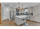 Open-concept kitchen with a center island, stainless appliances, and an inviting layout at 511 Hamilton Cottage Way, Raleigh, NC 27605
