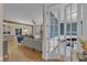 Inviting living room with open floor plan, hardwood floors, fireplace, and adjacent office space at 511 Hamilton Cottage Way, Raleigh, NC 27605
