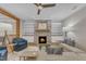 Cozy living room featuring a stone fireplace, hardwood floors, and comfortable seating at 511 Hamilton Cottage Way, Raleigh, NC 27605