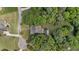 Beautiful property with well-manicured lawns and mature trees surrounding the home at 5308 Stableview Ct, Holly Springs, NC 27540