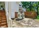 Spacious backyard features a cottage-style playhouse with a wooden deck and stairs enhancing outdoor living at 5308 Stableview Ct, Holly Springs, NC 27540
