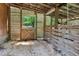 Inside the barn, highlighting wooden partitions and light-filled entrances, perfect for animals at 5308 Stableview Ct, Holly Springs, NC 27540