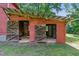 A red barn structure with open barn doors, providing access to the interior at 5308 Stableview Ct, Holly Springs, NC 27540