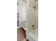 Bathroom with a bathtub-shower combination, tiled walls, and granite countertop sink at 5308 Stableview Ct, Holly Springs, NC 27540