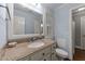 Bathroom featuring a neutral-colored vanity with a large, framed mirror at 5308 Stableview Ct, Holly Springs, NC 27540