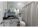 Stylish bathroom with a black countertop sink, accent mirror, and coordinated decor at 5308 Stableview Ct, Holly Springs, NC 27540
