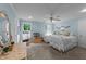 Bright blue bedroom with two beds, a ceiling fan, and a playful lemonade stand at 5308 Stableview Ct, Holly Springs, NC 27540