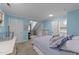 Comfortable blue bedroom showcasing a cozy layout with a small office or reading nook and ensuite bathroom at 5308 Stableview Ct, Holly Springs, NC 27540