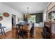 Elegant dining room featuring a large wooden table, a decorative chandelier, and vintage accents at 5308 Stableview Ct, Holly Springs, NC 27540