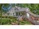 Charming front exterior with landscaped garden, inviting porch, and beautiful curb appeal at 5308 Stableview Ct, Holly Springs, NC 27540