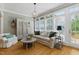 Bright living room featuring hardwood floors, a neutral color palette, and lots of natural light at 5308 Stableview Ct, Holly Springs, NC 27540