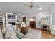 Cozy living room with a fireplace, wood floors, comfortable seating, and built-in shelving at 5308 Stableview Ct, Holly Springs, NC 27540