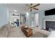 Cozy living room features light blue walls, fireplace, and comfortable seating area at 5308 Stableview Ct, Holly Springs, NC 27540