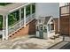 Charming playhouse featuring a cottage design with flower boxes and a small bench, nestled next to brick stairs at 5308 Stableview Ct, Holly Springs, NC 27540