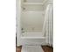 Classic bathroom with a white tiled shower/tub and neutral color palette for a clean aesthetic at 5308 Stableview Ct, Holly Springs, NC 27540