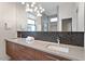 Bright bathroom with double vanity, hexagon tile backsplash, and a large mirror at 610 Velma Hopkins Ln, Raleigh, NC 27603