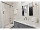 Cozy bathroom features subway tile, vanity with white marble countertop, and modern fixtures at 610 Velma Hopkins Ln, Raleigh, NC 27603