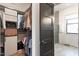 Open closet with dark trim and access to a bathroom at 610 Velma Hopkins Ln, Raleigh, NC 27603