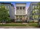 Charming three-story home with a welcoming front porch and manicured lawn at 610 Velma Hopkins Ln, Raleigh, NC 27603