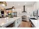 Spacious kitchen with stainless steel appliances, white cabinets, quartz countertops, and an island at 610 Velma Hopkins Ln, Raleigh, NC 27603