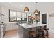 Bright kitchen features a large center island, pendant lighting, and stainless steel appliances at 610 Velma Hopkins Ln, Raleigh, NC 27603